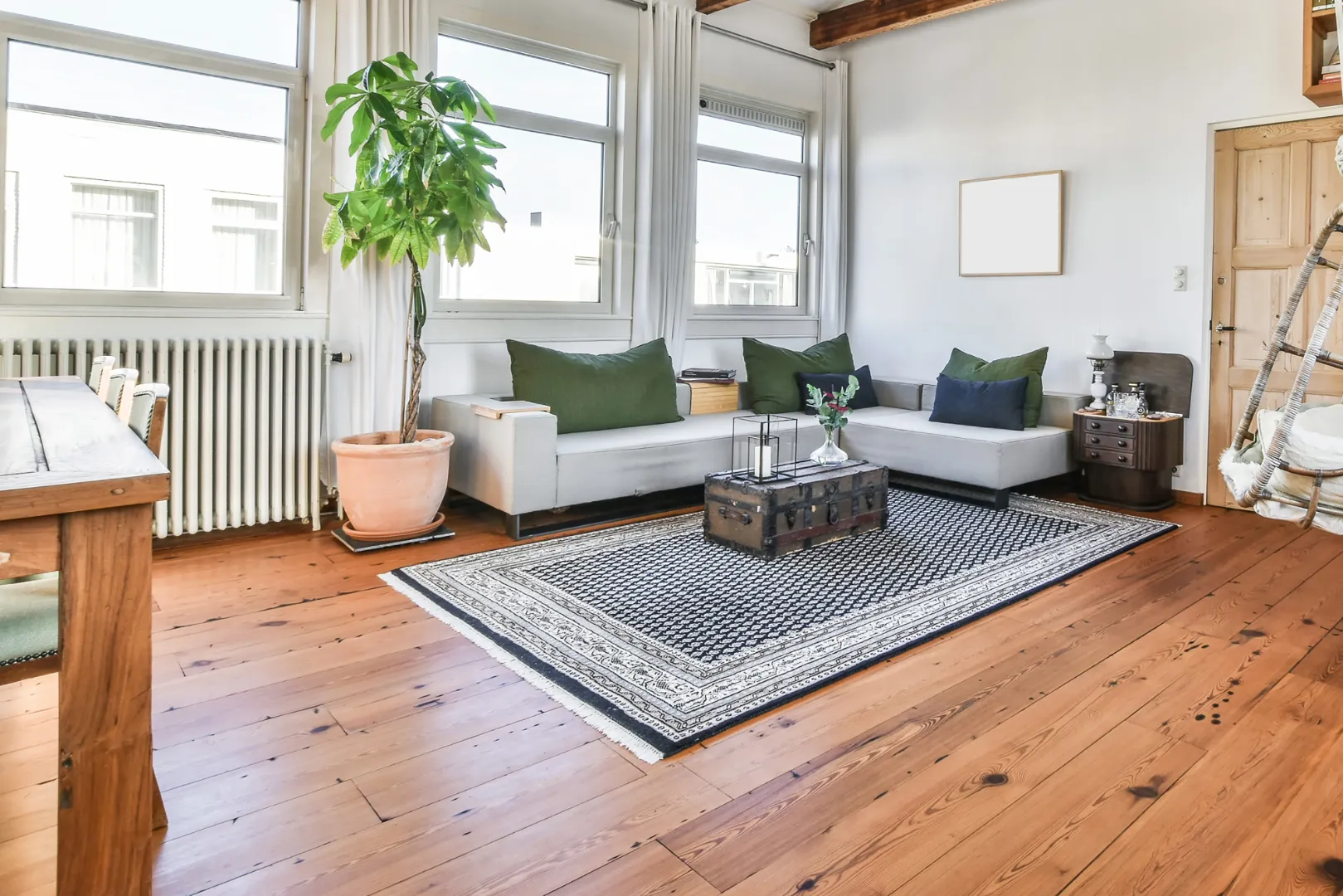 Redwood decking with natural wood flooring in a bright indoor living space